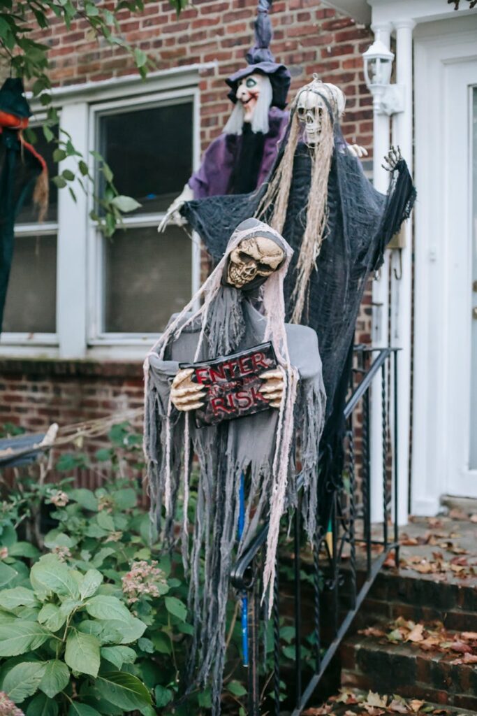 creepy skeletons and witch near building